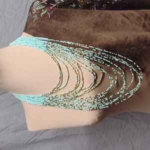 Turquoise and gold beaded multi-layered necklace